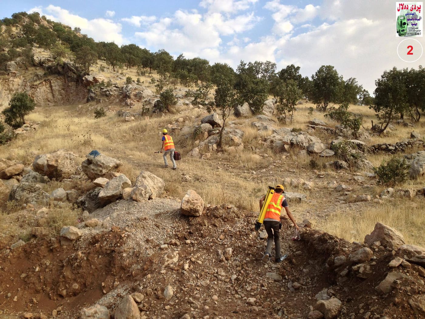 Surveyor taking levels for a topographic survey